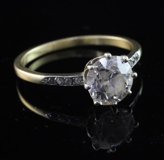 An 18ct gold and platinum solitaire diamond ring, size T.